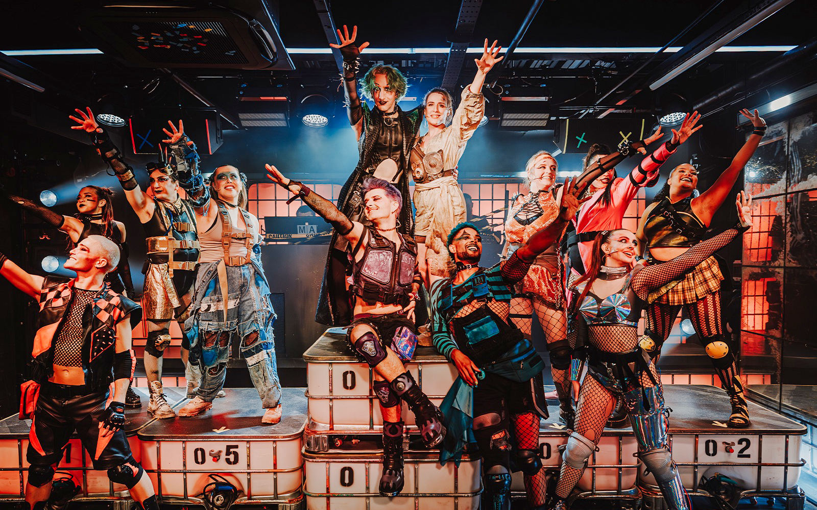 Performers in futuristic costumes at Oscar at the Crown show.