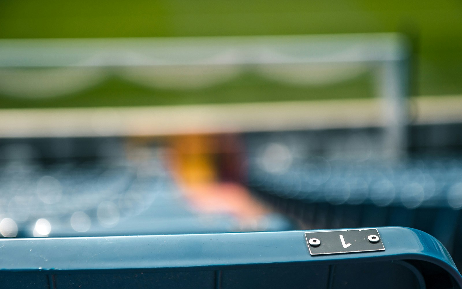 VIP seating area at Santiago Bernabéu Stadium with blurred field view.