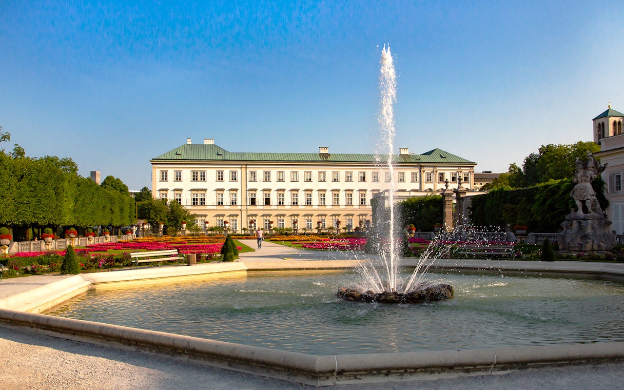 Mirabell Palace gardens with fountain in Salzburg, featured in the Original Sound of Music Tour.