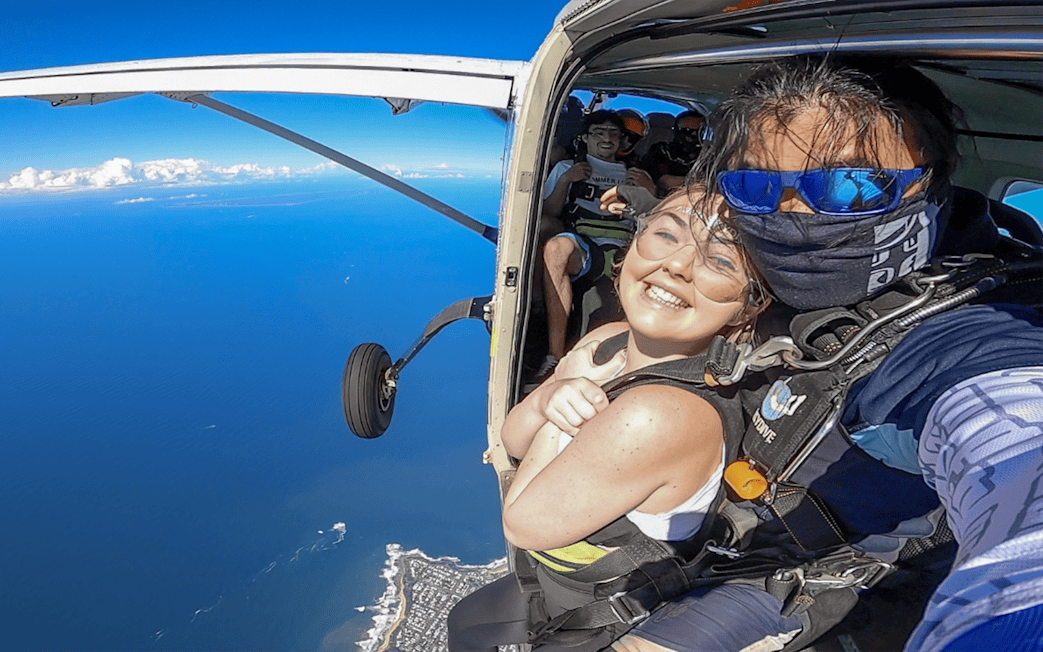 Tandem skydive over Sunshine Coast with ocean view and beach landing.