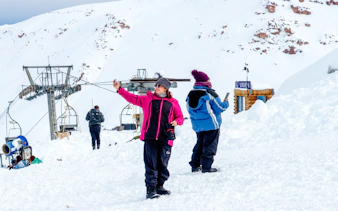 Visitors taking photos at Valle Nevado ski resort, Santiago.