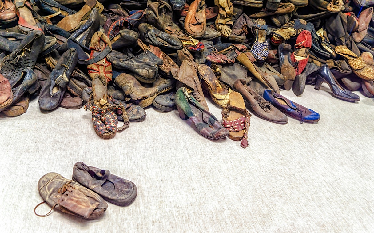 Shoes from Holocaust victims at Auschwitz Birkenau Memorial Museum exhibit.