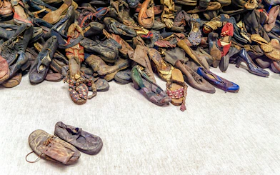 Shoes from Holocaust victims at Auschwitz Birkenau Memorial Museum exhibit.