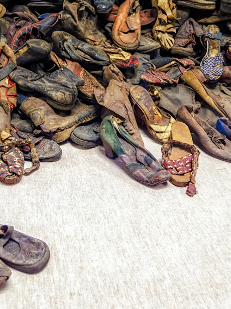 Shoes from Holocaust victims at Auschwitz Birkenau Memorial Museum exhibit.