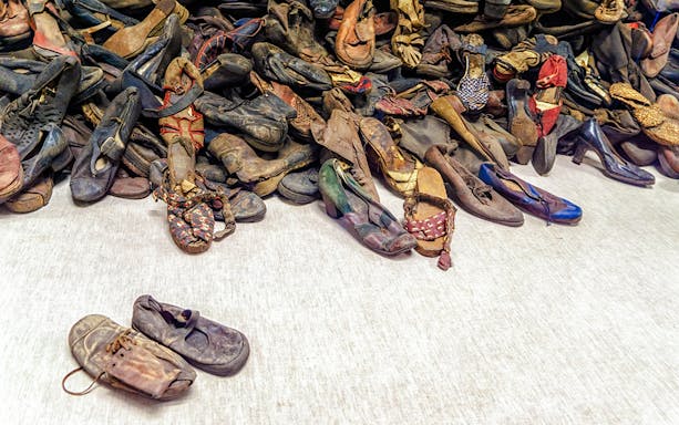 Shoes from Holocaust victims at Auschwitz Birkenau Memorial Museum exhibit.