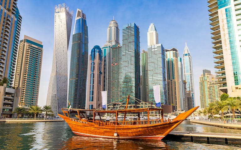 Tourist boat Abra cruising on Dubai canal, UAE.