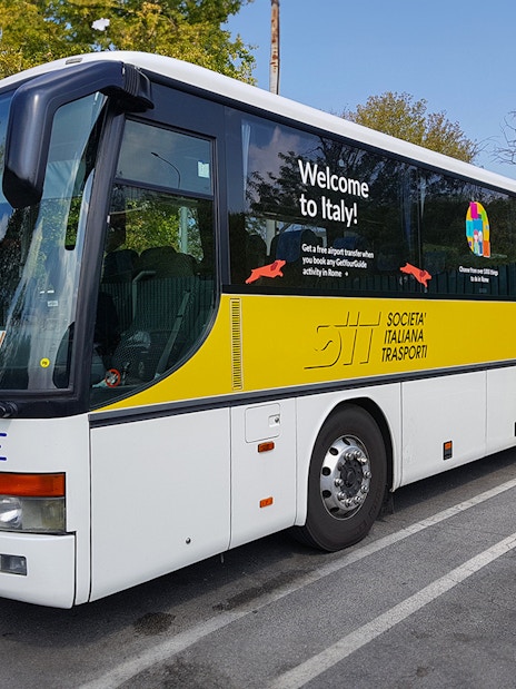 SIT Bus Shuttle parked in a lot, offering transport services in Italy.