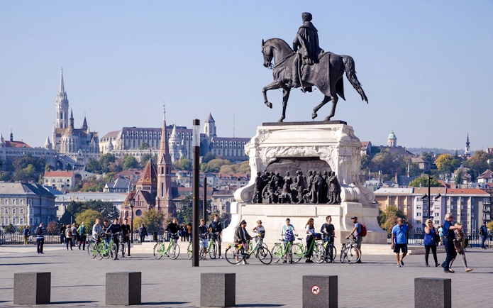Equestrian statue of Count Gyula Andrássy in Kossuth Square, Budapest, with cityscape in background.