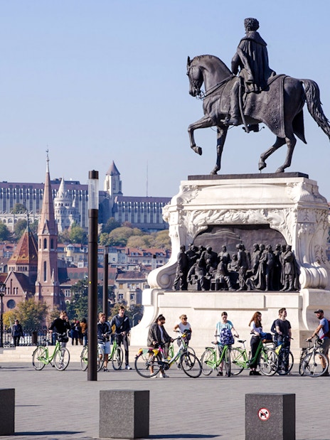 Equestrian statue of Count Gyula Andrássy in Kossuth Square, Budapest, with cityscape in background.
