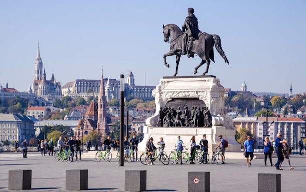 Equestrian statue of Count Gyula Andrássy in Kossuth Square, Budapest, with cityscape in background.