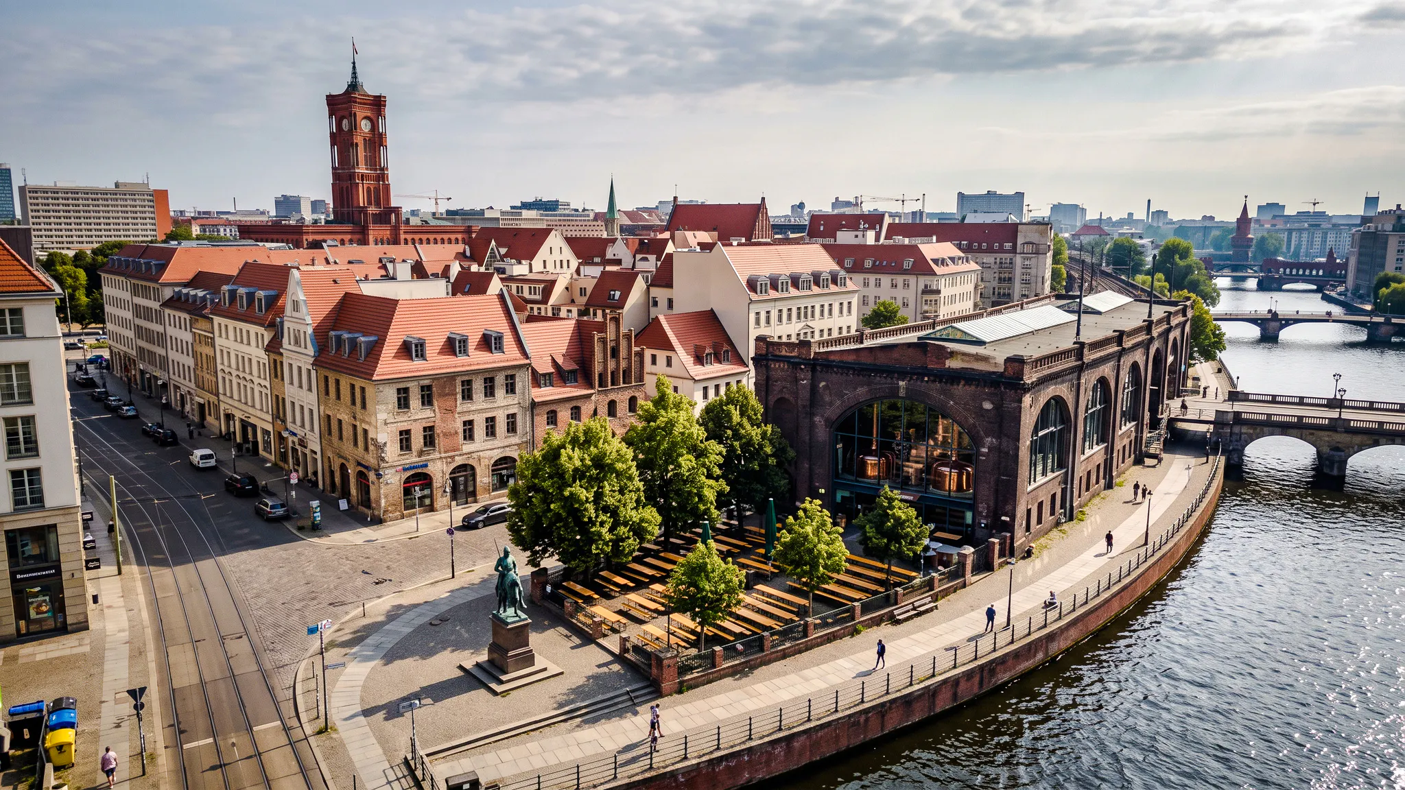 Berlin cityscape with historic buildings and a riverside brewery, part of the Oktoberfest walking tour.