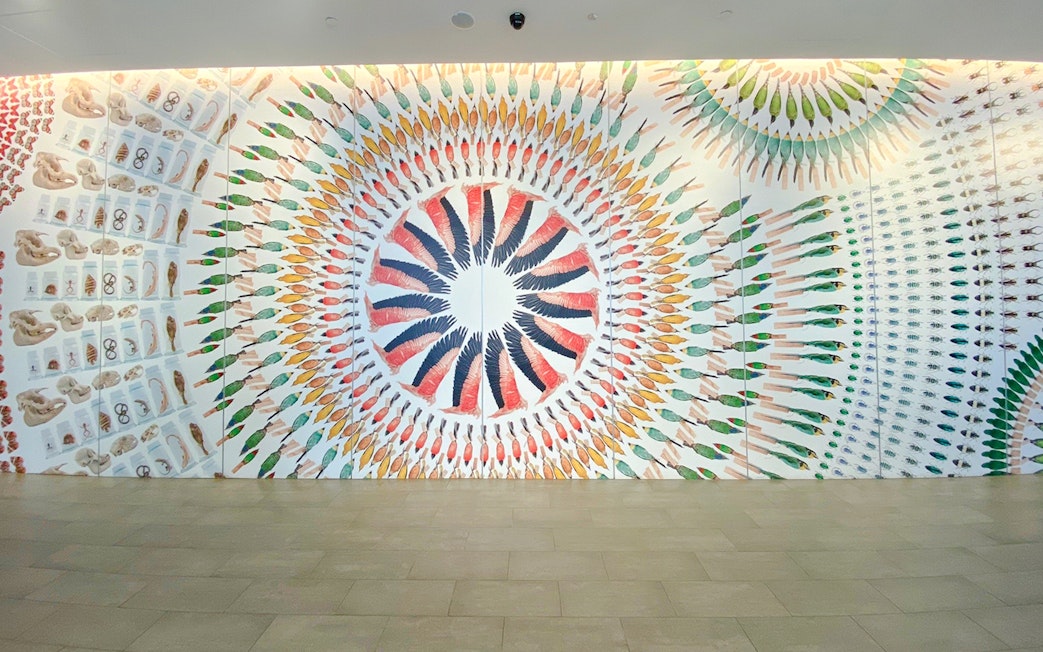 Colorful animal illustration mural at Lee Kong Chian Natural History Museum.