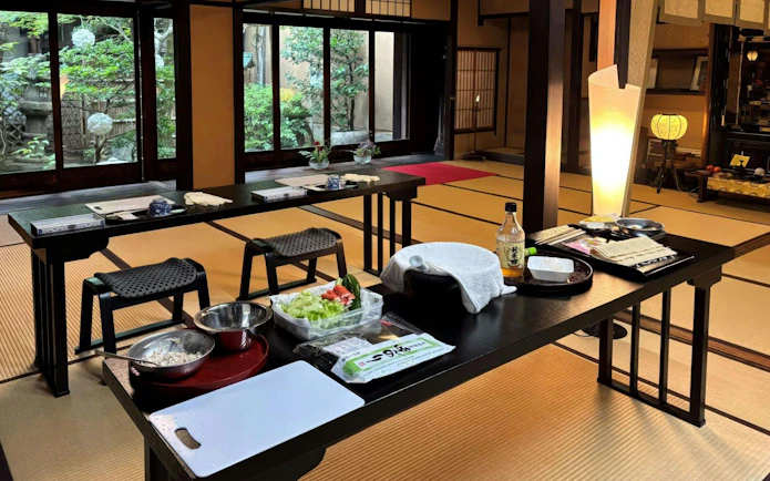 Sushi class setup with ingredients and tools in a traditional Kyoto room.