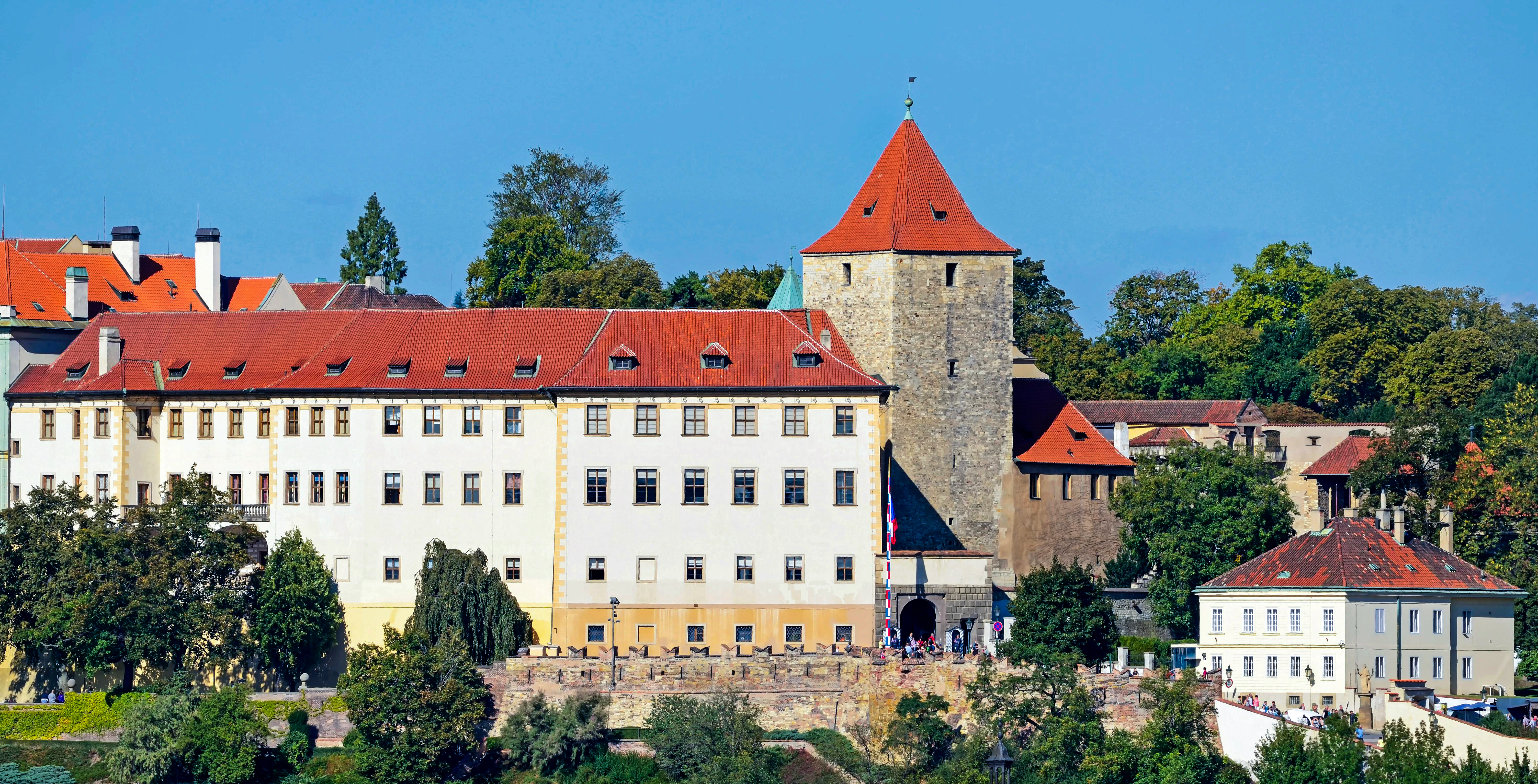 Prague Castle complex with Lobkowicz Palace and red-roofed buildings.