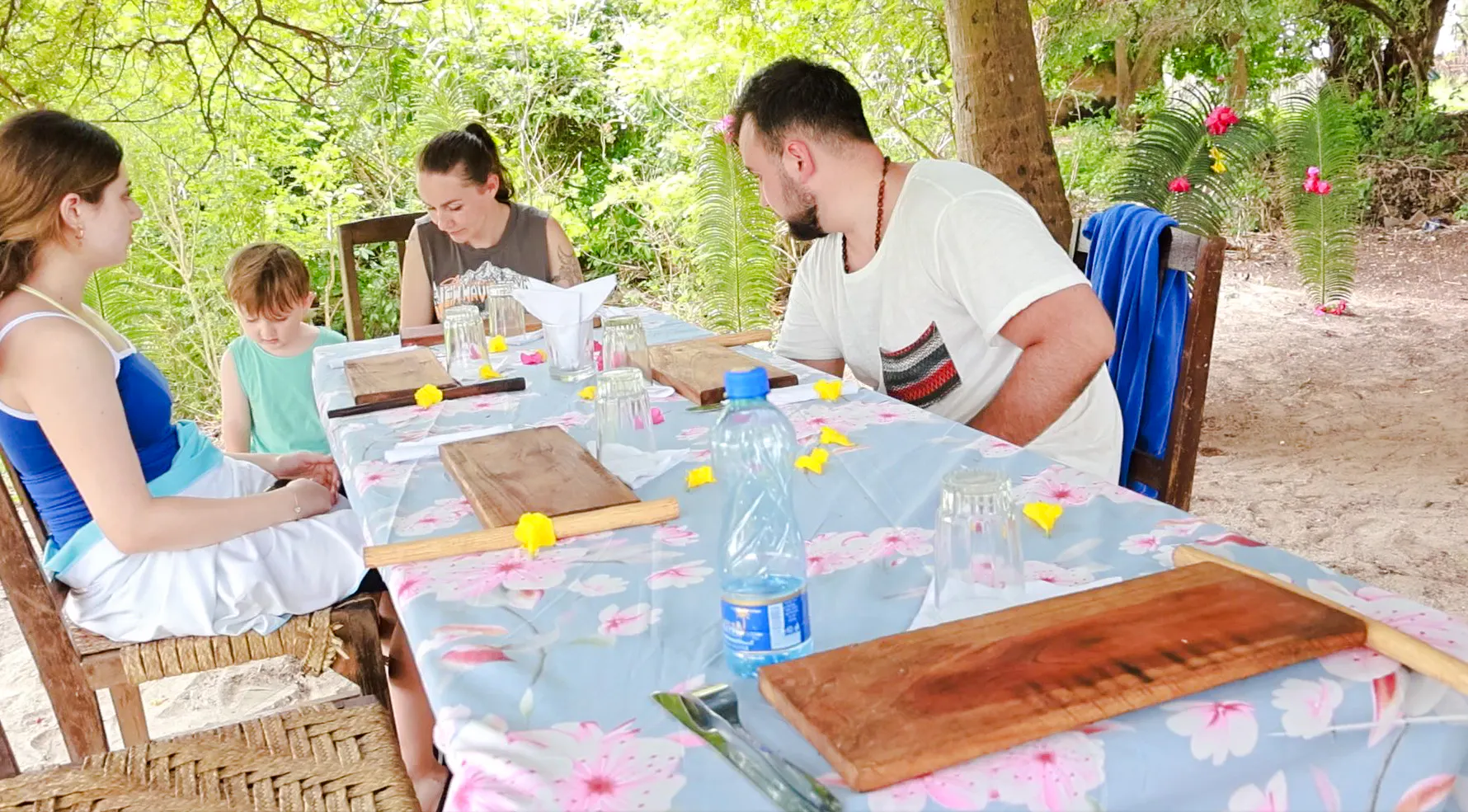 Group dining outdoors on Funzi Island excursion, Diani Beach.