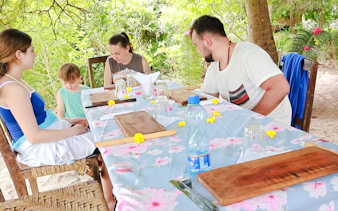 Group dining outdoors on Funzi Island excursion, Diani Beach.