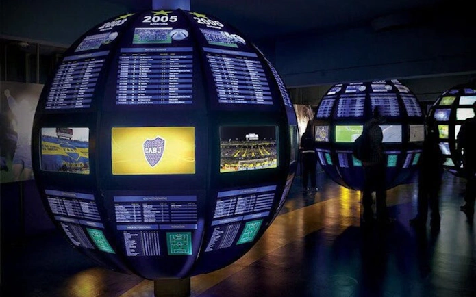 Interactive displays at La Bombonera museum showcasing Boca Juniors' history.