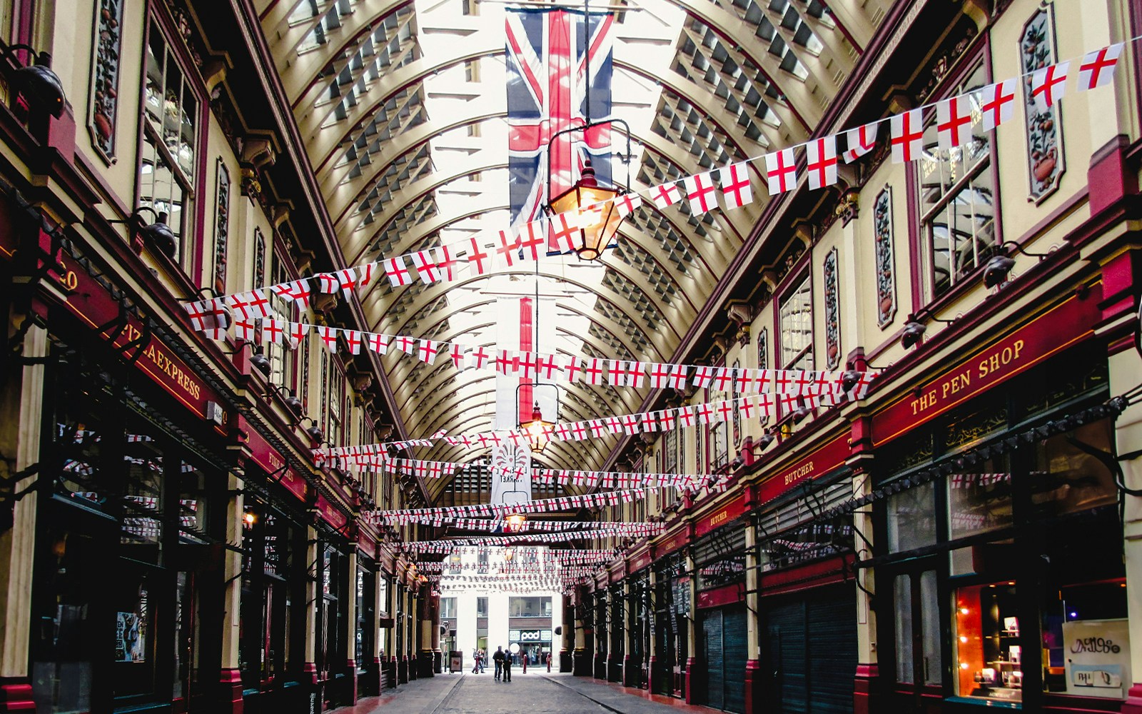Borough Market arcade with flags, part of Harry Potter film locations tour in London.