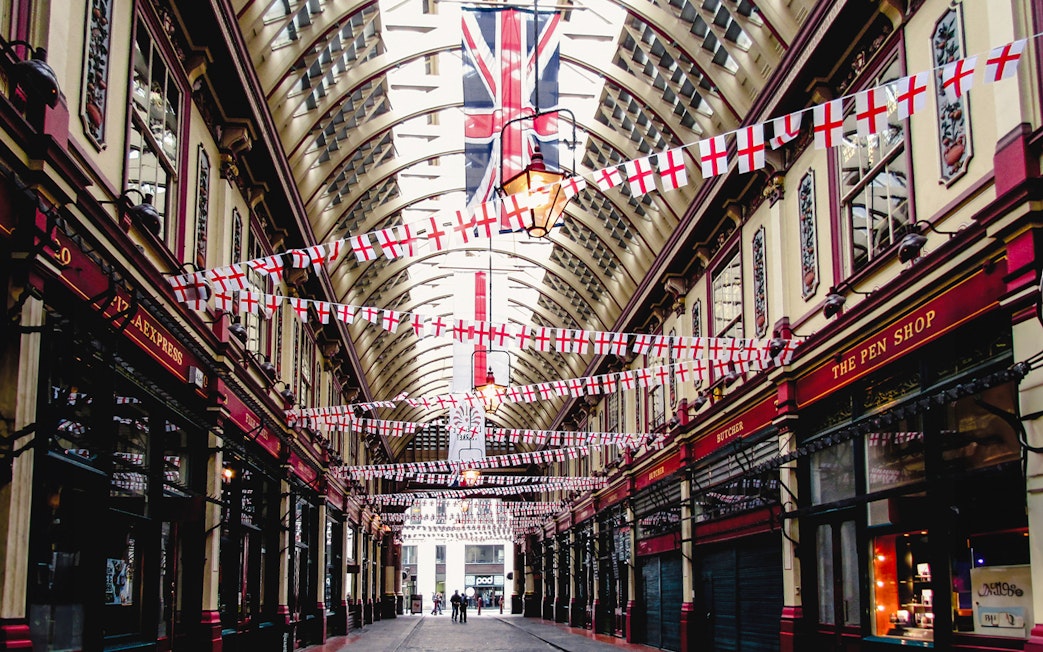 Borough Market arcade with flags, part of Harry Potter film locations tour in London.