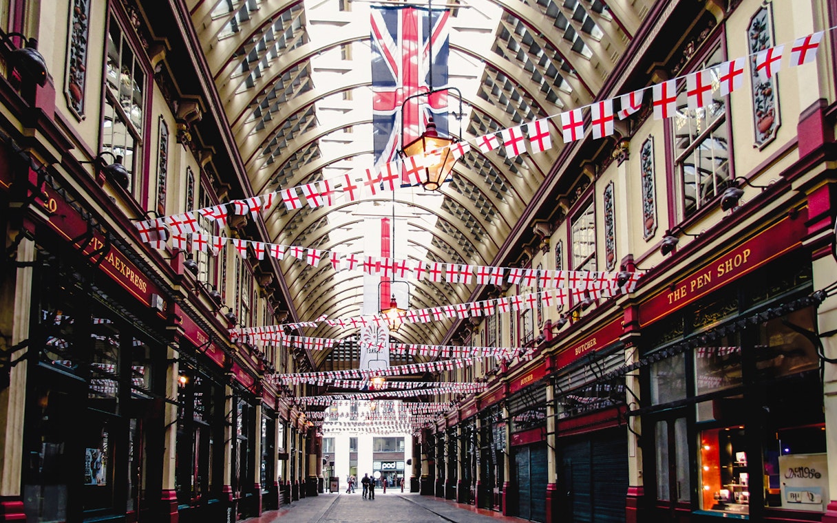 Borough Market arcade with flags, part of Harry Potter film locations tour in London.