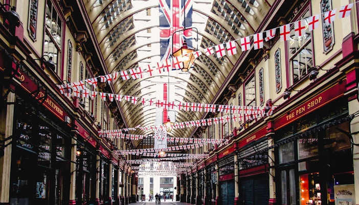 Borough Market arcade with flags, part of Harry Potter film locations tour in London.