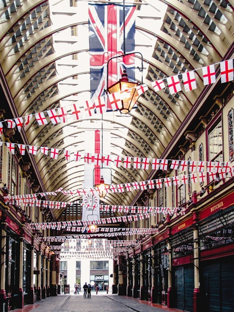 Borough Market arcade with flags, part of Harry Potter film locations tour in London.