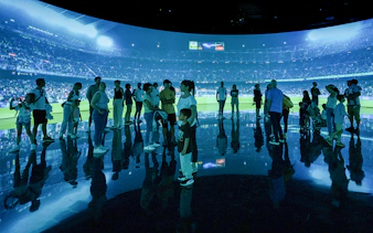 Visitors at FC Barcelona immersive stadium tour experience.