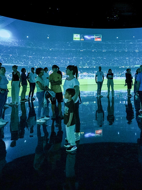 Visitors at FC Barcelona immersive stadium tour experience.