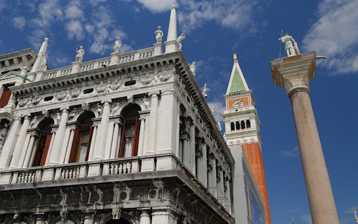 Marciana Library facade with St Theodore on a pillar in St Mark's Piazzetta, Venice.