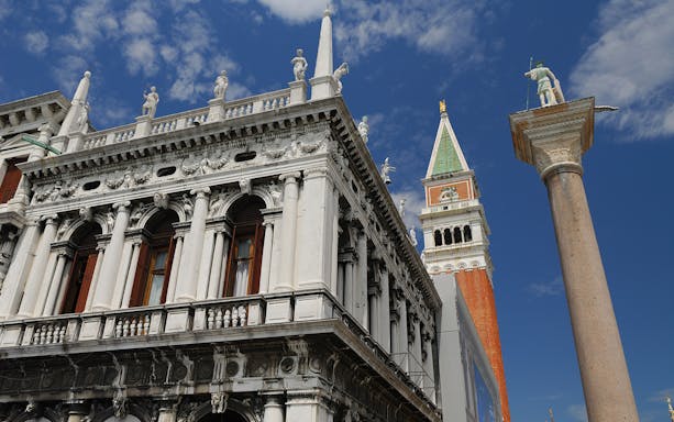 Marciana Library facade with St Theodore on a pillar in St Mark's Piazzetta, Venice.