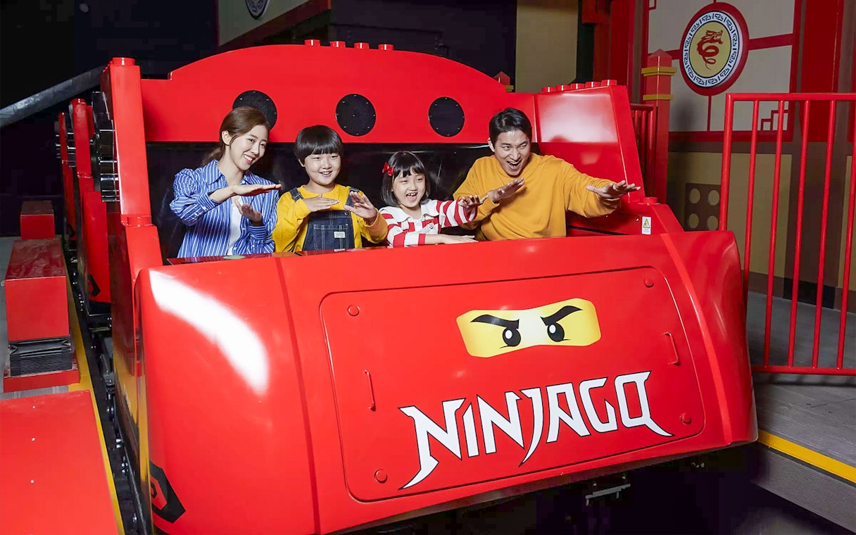 Family enjoying Ninjago ride at LEGOLAND Korea.