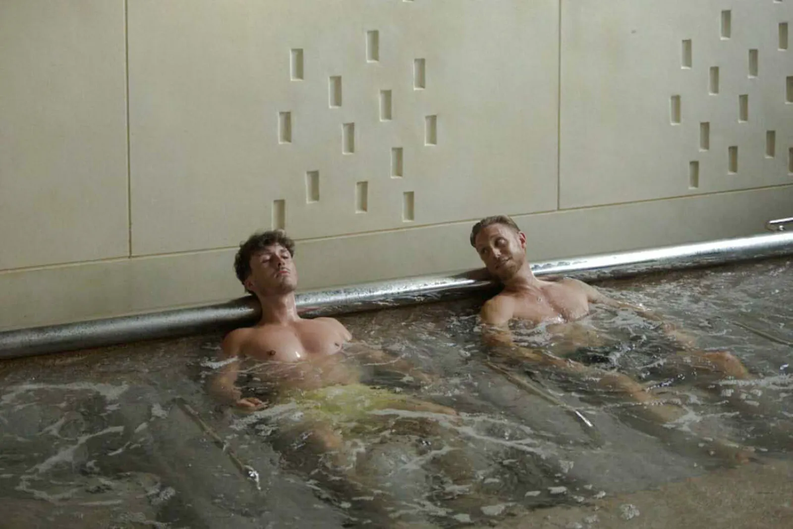 Two people relaxing in a hot spring bath at Yunomori Onsen & Spa, Pattaya.