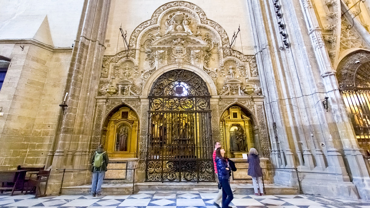 Seville Cathedral entrance with tourists using fast track tickets.