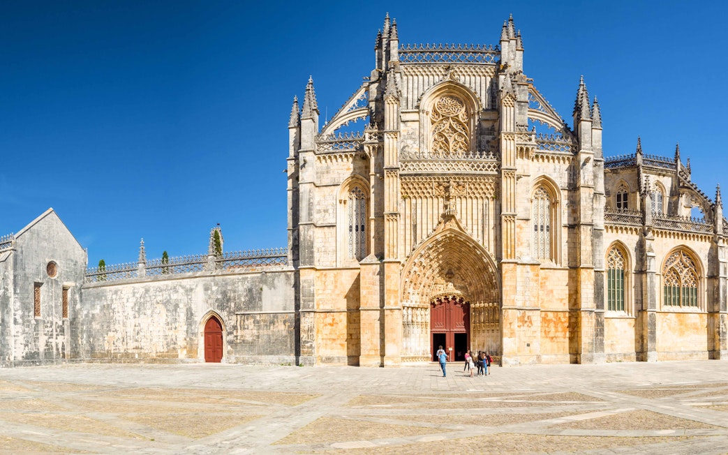 Batalha Monastery facade with intricate Gothic architecture in Portugal.