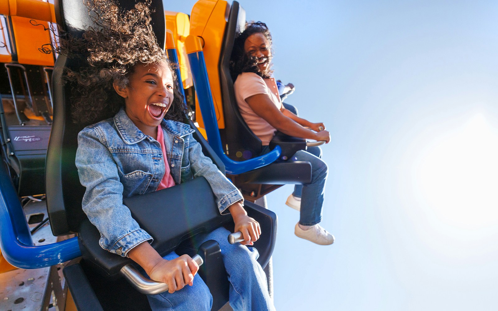 Riders enjoying the Georgia Gold Rusher roller coaster at Six Flags Over Georgia.