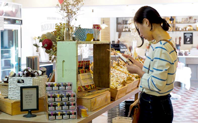 Shopper browsing local products in a store at Hahndorf, Adelaide Hills.