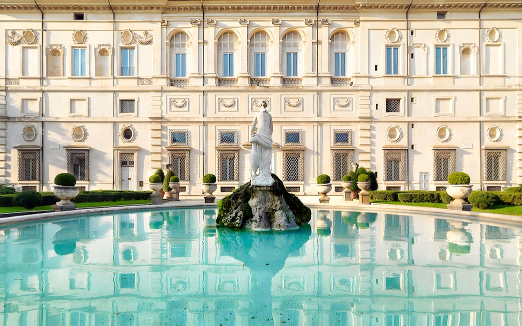 Borghese Gallery fountain with statue in front of historic building, Rome.