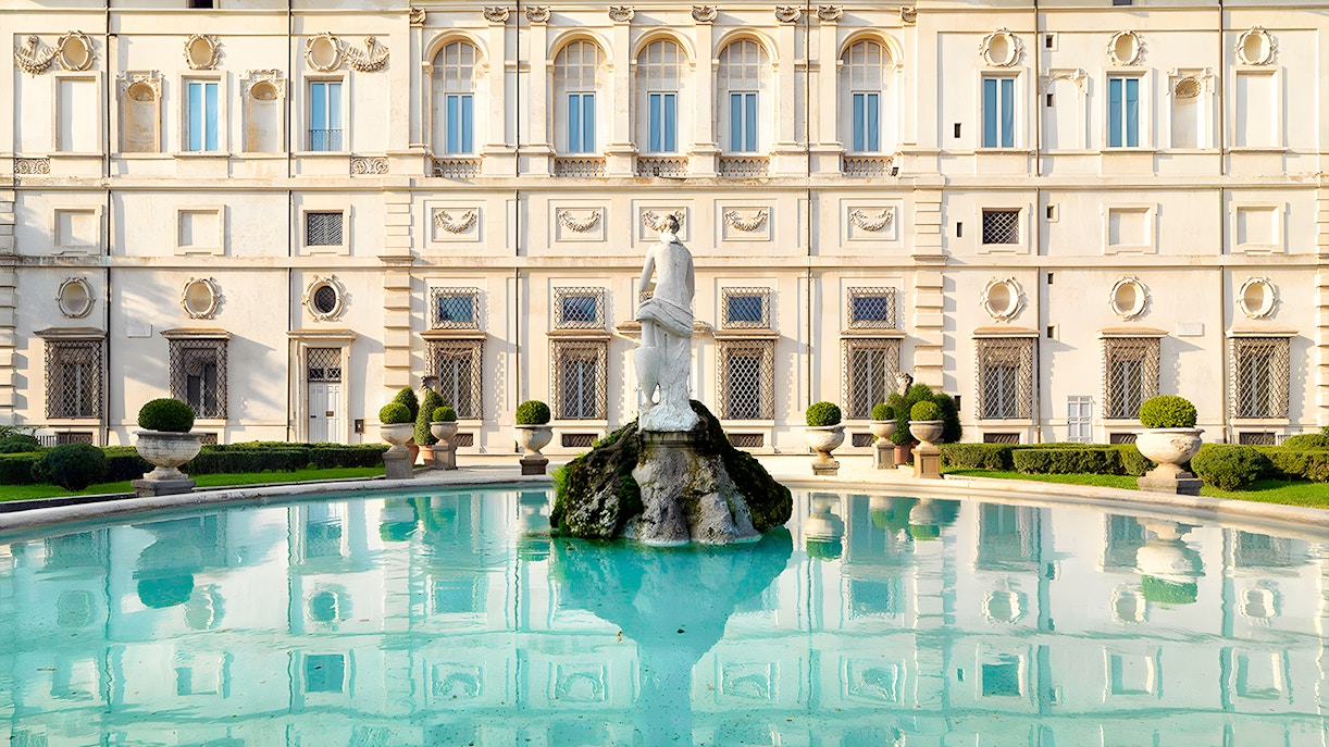 Borghese Gallery fountain with statue in front of historic building, Rome.