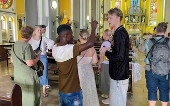 Tour group inside a church in Dar es Salaam during Zanzibar day trip.