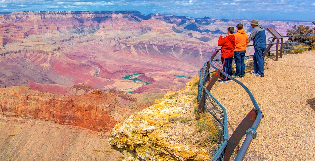 Tourists enjoying a scenic view from the Grand Canyon South Rim Bus tour in Las Vegas