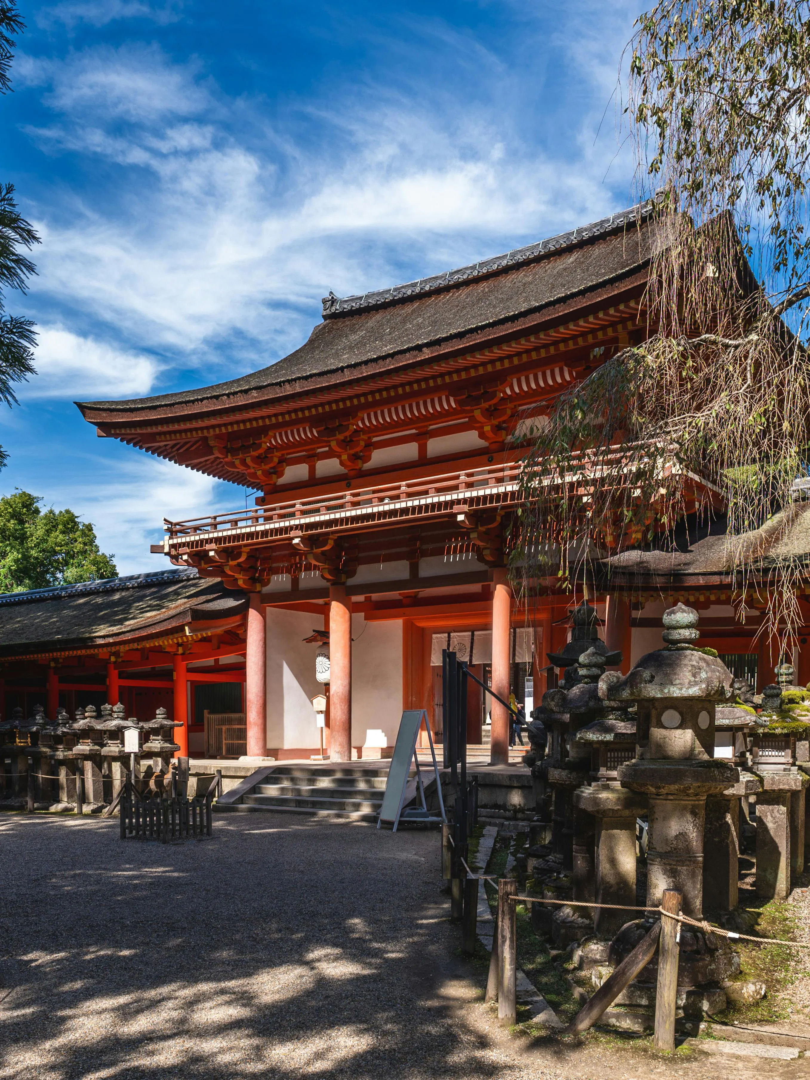 Kasuga Taisha Shrine entrance with stone lanterns, Nara, Japan.