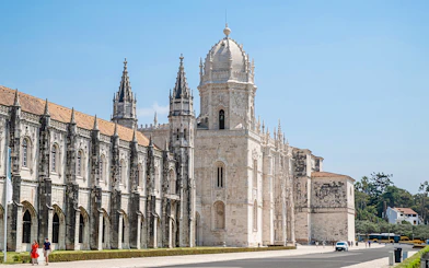 Jeronimos Monastery's ornate facade and towers in Lisbon, Portugal.
