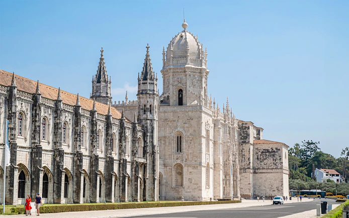 Jeronimos Monastery's ornate facade and towers in Lisbon, Portugal.