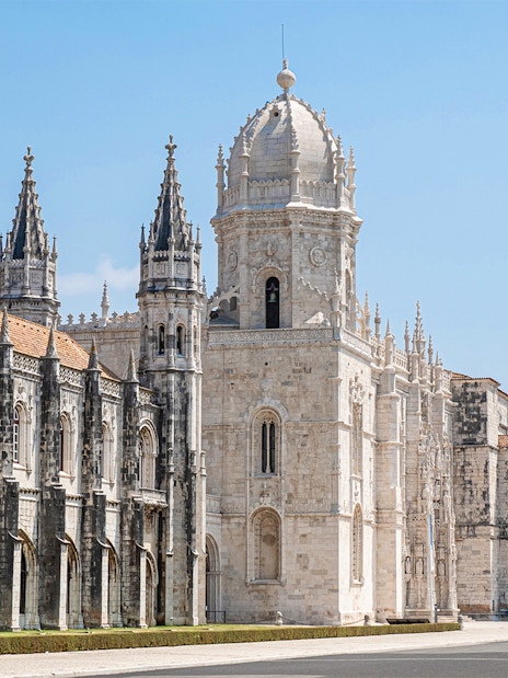 Jeronimos Monastery's ornate facade and towers in Lisbon, Portugal.