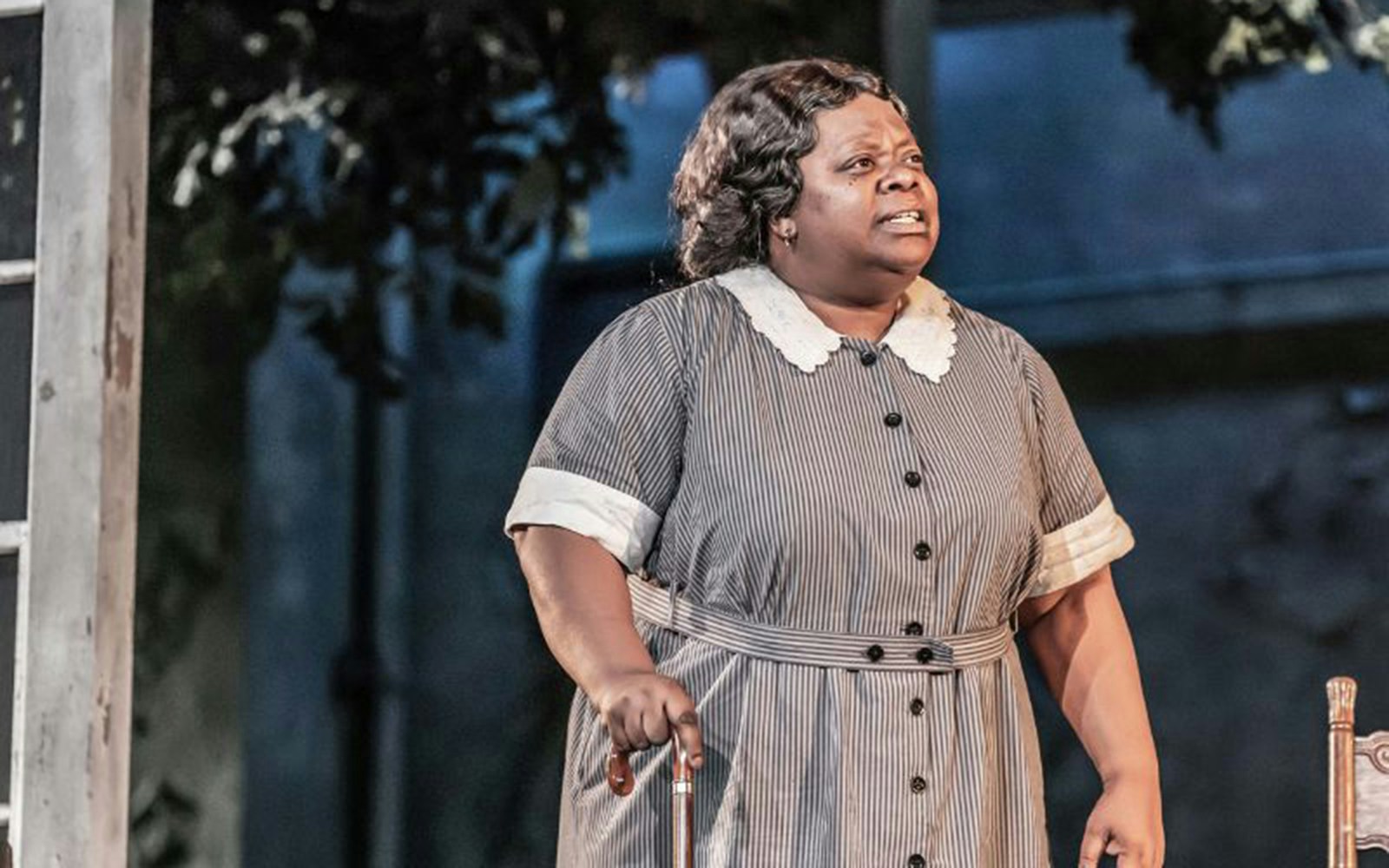 Stage performance of "To Kill A Mockingbird" with actor in period costume.