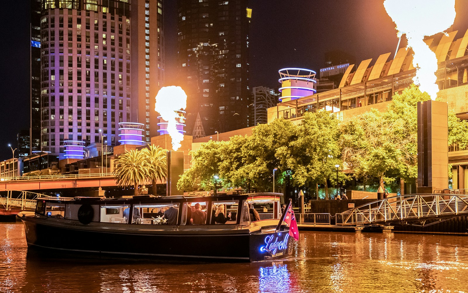 Lady M boat on Yarra River near Crown Casino at dusk, Melbourne.