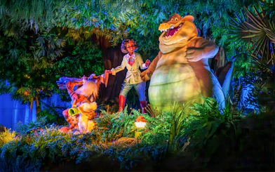 Tiana and friends in a vibrant bayou scene at night, Walt Disney World Resort, Orlando.