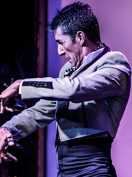 Flamenco dancer performing at Tablao El Arenal in Seville.