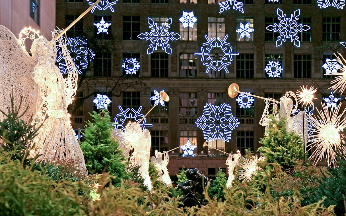 Illuminated angel sculptures and snowflake lights on a Holiday Lights Tour.