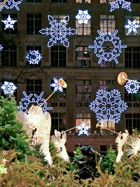 Illuminated angel sculptures and snowflake lights on a Holiday Lights Tour.